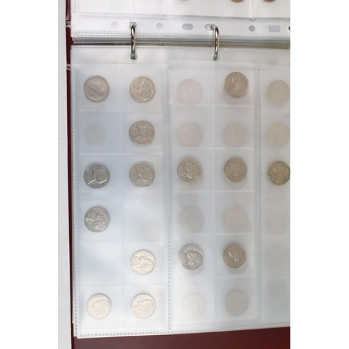 236 - A very large collection of mixed World coins in alphabetical order within six collectors albums.