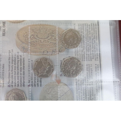 239 - A large collection of British decimal 50p, £2 and £5 collectors coins contained within two albums to... 