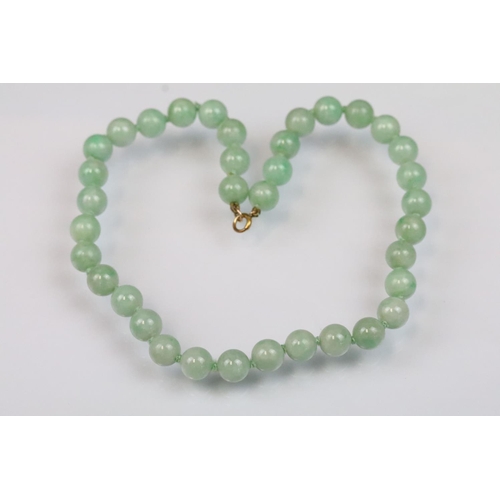17 - Jace beaded necklace threaded with green jadeite spherical beads with a 9ct gold clasp. Measures 15 ... 