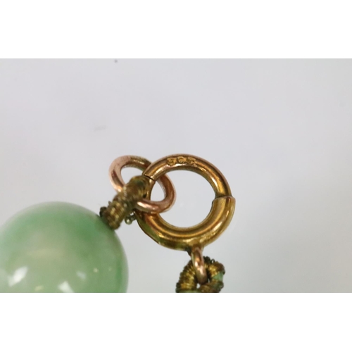 17 - Jace beaded necklace threaded with green jadeite spherical beads with a 9ct gold clasp. Measures 15 ... 