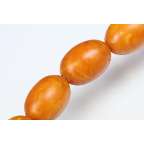 6 - Butterscotch amber beaded necklace having 39 graduating oval beads with a 9ct gold clasp. Largest be... 
