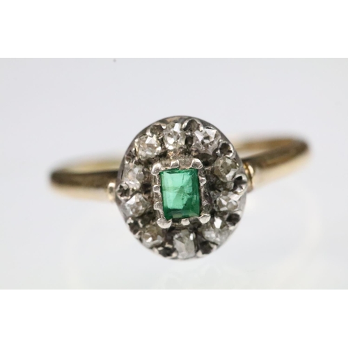 31 - 19th Century Victorian emerald and diamond halo ring. The ring being set with a step cut emerald to ... 