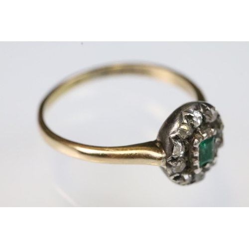 31 - 19th Century Victorian emerald and diamond halo ring. The ring being set with a step cut emerald to ... 