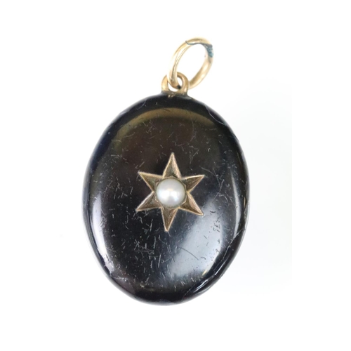 49 - 19th Century Victorian pearl and black enamel mourning locket. The locket of oval form with a star t... 