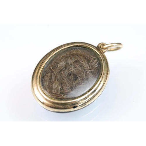 49 - 19th Century Victorian pearl and black enamel mourning locket. The locket of oval form with a star t... 