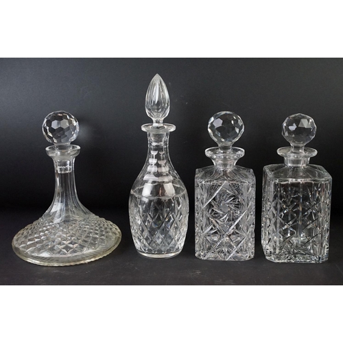 72 - Large selection of cut glass with decanters including two square cut, one round and a ship decanter ... 