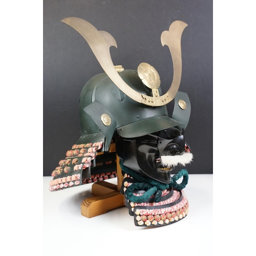 100 - Japanese Samurai helmet suit of armour replica with colourful cotton thread weaving on mount stand.