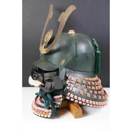100 - Japanese Samurai helmet suit of armour replica with colourful cotton thread weaving on mount stand.
