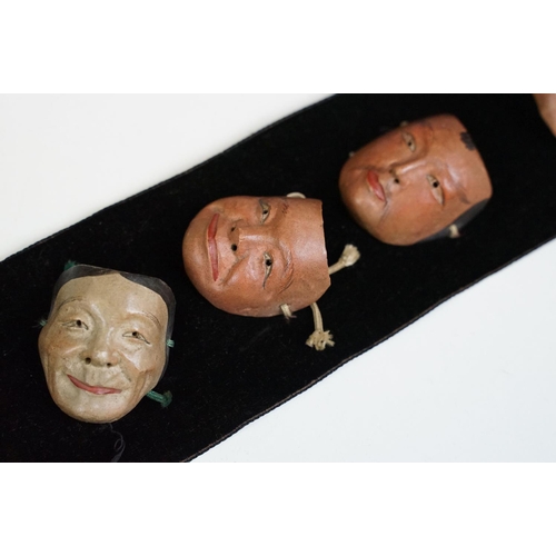 117 - Assortment of oriental items to include a set of eight Japanese wooden miniature character masks and... 