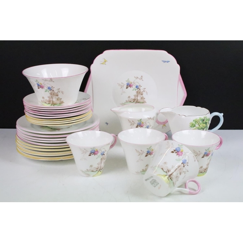 15 - Shelley tea set with pastel floral design to include four tea cups, 6 pink rim saucers, four yellow ... 