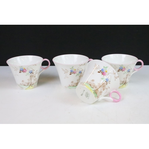 15 - Shelley tea set with pastel floral design to include four tea cups, 6 pink rim saucers, four yellow ... 