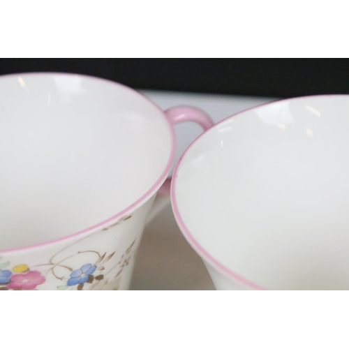 15 - Shelley tea set with pastel floral design to include four tea cups, 6 pink rim saucers, four yellow ... 