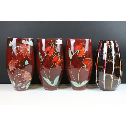 17 - Trio of Anita Harris AHS abstract red glaze pottery vases with floral hand painted decoration and a ... 