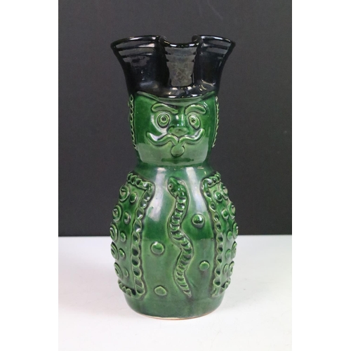 18 - Hungarian Folk Art green glazed wine pitcher in the form of a soldier, 20cm high