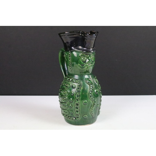 18 - Hungarian Folk Art green glazed wine pitcher in the form of a soldier, 20cm high