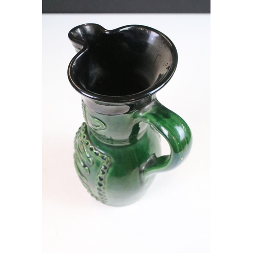 18 - Hungarian Folk Art green glazed wine pitcher in the form of a soldier, 20cm high