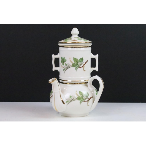 22 - J.Chomette & Son Ltd French stack infuser teapot with side handle decorated with a foliage design an... 