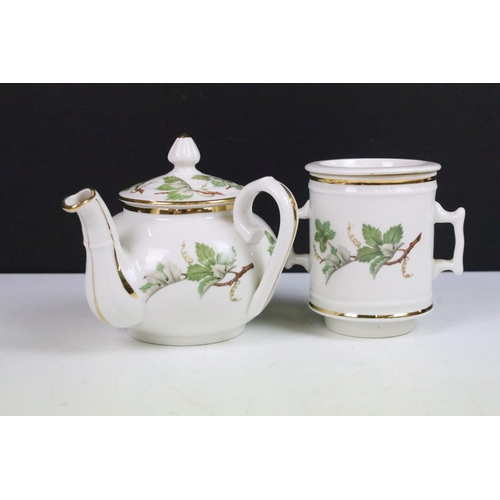 22 - J.Chomette & Son Ltd French stack infuser teapot with side handle decorated with a foliage design an... 