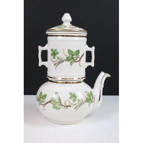 22 - J.Chomette & Son Ltd French stack infuser teapot with side handle decorated with a foliage design an... 