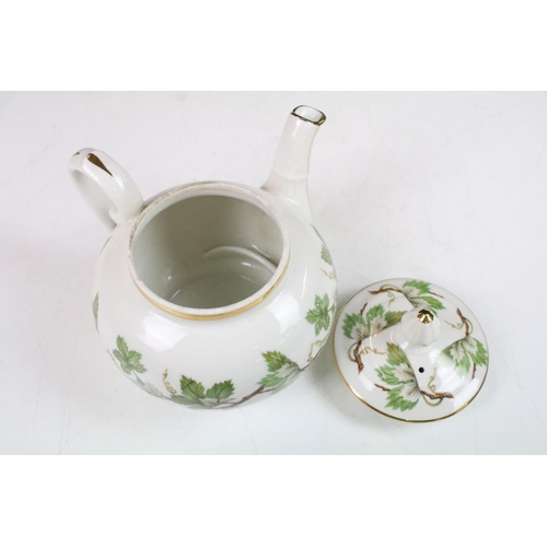 22 - J.Chomette & Son Ltd French stack infuser teapot with side handle decorated with a foliage design an... 