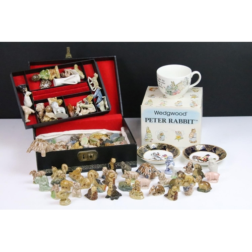 24 - Large assortment of Wade whimsies together with a Wedgwood Peter Rabbit mug and a pair of Thelwell F... 