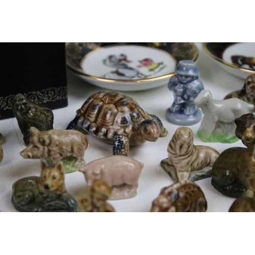 24 - Large assortment of Wade whimsies together with a Wedgwood Peter Rabbit mug and a pair of Thelwell F... 