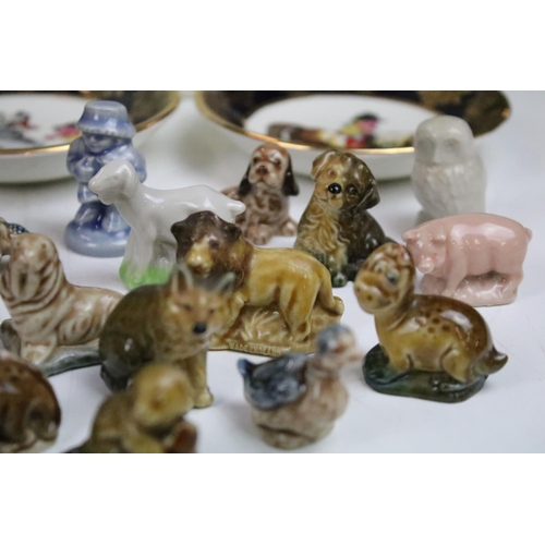 24 - Large assortment of Wade whimsies together with a Wedgwood Peter Rabbit mug and a pair of Thelwell F... 