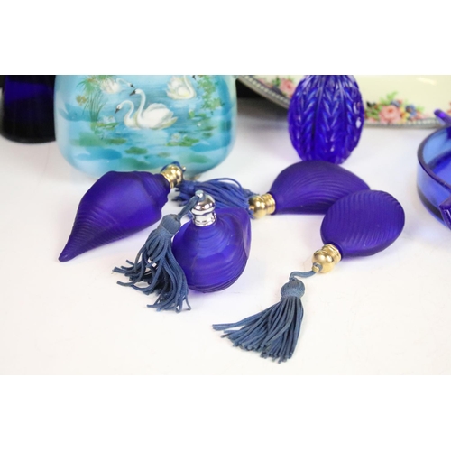 66 - Selection of blue glass decorative items to include atomiser perfume bottle, scent bottles, swan, pi... 
