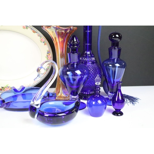 66 - Selection of blue glass decorative items to include atomiser perfume bottle, scent bottles, swan, pi... 