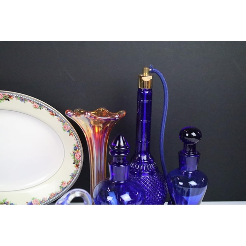 66 - Selection of blue glass decorative items to include atomiser perfume bottle, scent bottles, swan, pi... 