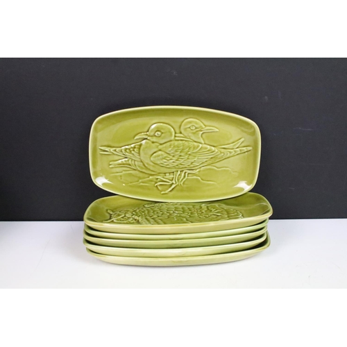 68 - Mid century Poole Pottery two tone coffee set comprising two coffee pots, six coffee cups and six sa... 