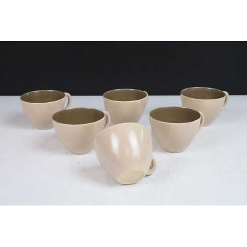68 - Mid century Poole Pottery two tone coffee set comprising two coffee pots, six coffee cups and six sa... 