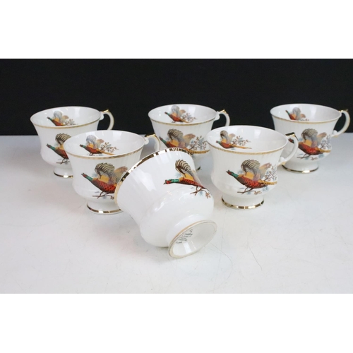 69 - Six Staffordshire Sheridan pheasant design trios along with a selection of Carlton ware floral items... 
