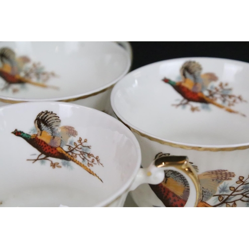 69 - Six Staffordshire Sheridan pheasant design trios along with a selection of Carlton ware floral items... 