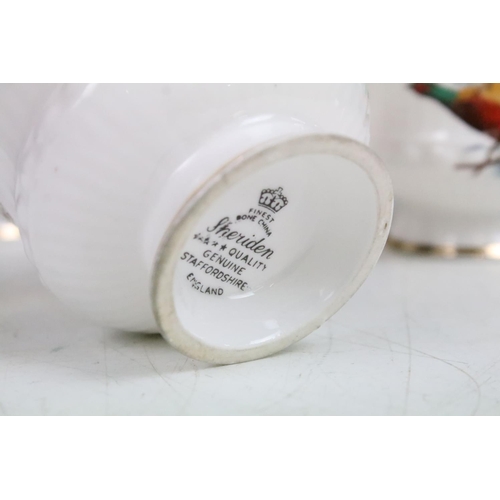 69 - Six Staffordshire Sheridan pheasant design trios along with a selection of Carlton ware floral items... 