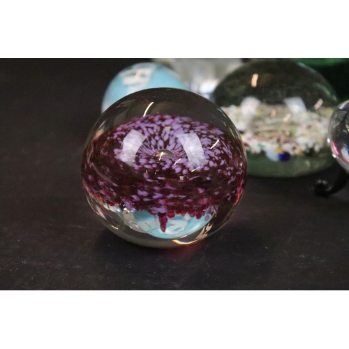 71 - Assortment of coloured glass paperweights and decorative glass vases