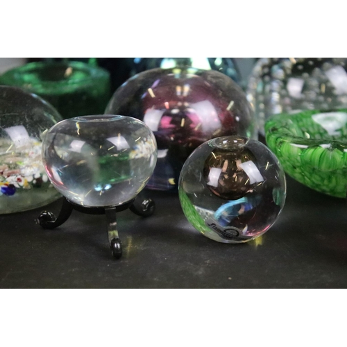 71 - Assortment of coloured glass paperweights and decorative glass vases
