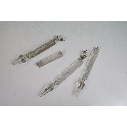 78 - Pair of Victorian pink glass lustres with painted floral decoration and prismatic drops. 31cm tall.