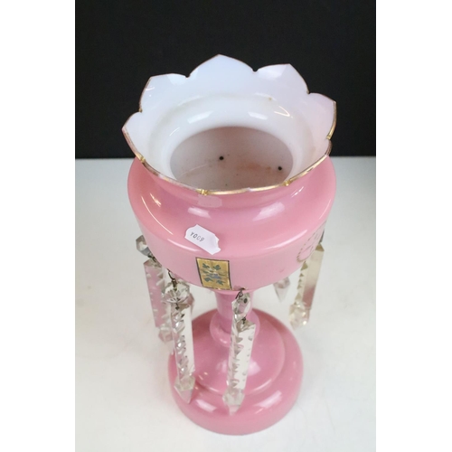 78 - Pair of Victorian pink glass lustres with painted floral decoration and prismatic drops. 31cm tall.