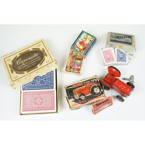 294 - Boxed vintage Tri-ang Minic tractor, together with antique miniature playing cards, picture block pu... 