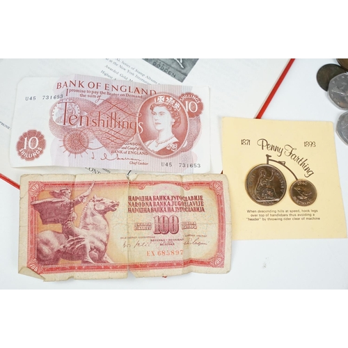 298 - Small groups of coins including commemorative crowns together with two albums of stamps.