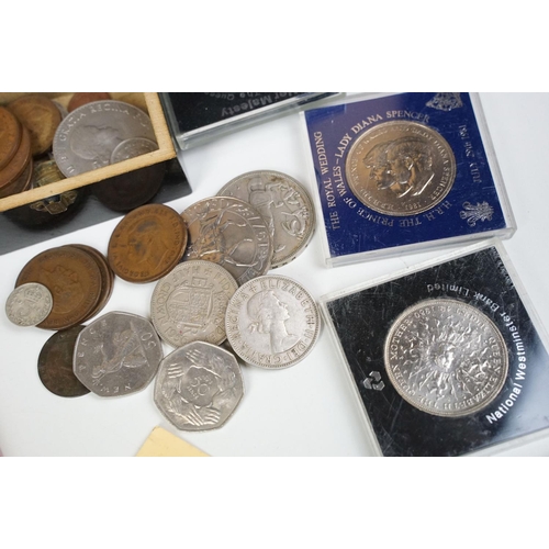 298 - Small groups of coins including commemorative crowns together with two albums of stamps.