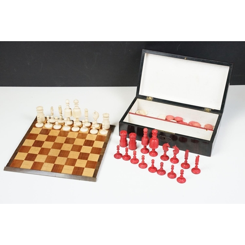 300 - Early 20th century Small box of travel chess pieces and roll out mat board.