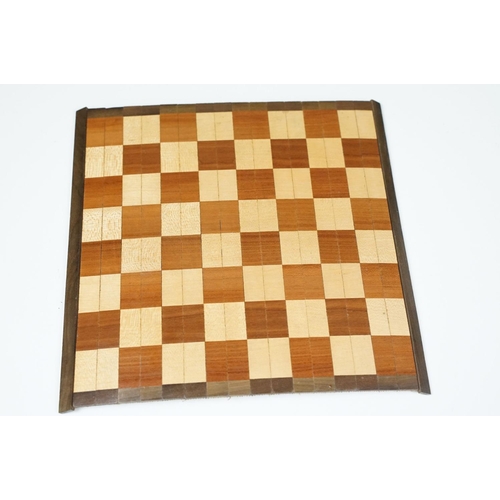 300 - Early 20th century Small box of travel chess pieces and roll out mat board.