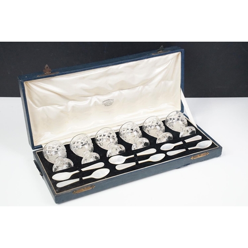 301 - Set of six Edinburgh crystal egg cups with six mother of pearl spoons presented in a Fenton Russell ... 