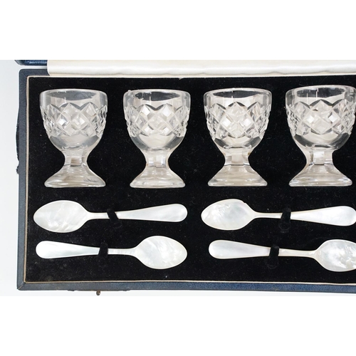 301 - Set of six Edinburgh crystal egg cups with six mother of pearl spoons presented in a Fenton Russell ... 