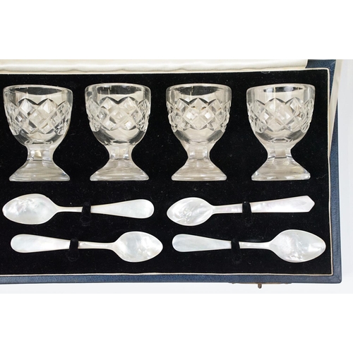 301 - Set of six Edinburgh crystal egg cups with six mother of pearl spoons presented in a Fenton Russell ... 