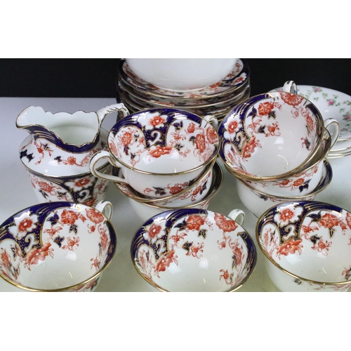 57 - Bridgwoods Ceylon tea set in colbalt and red finish with twelve cups and saucers, milk jug and sugar... 