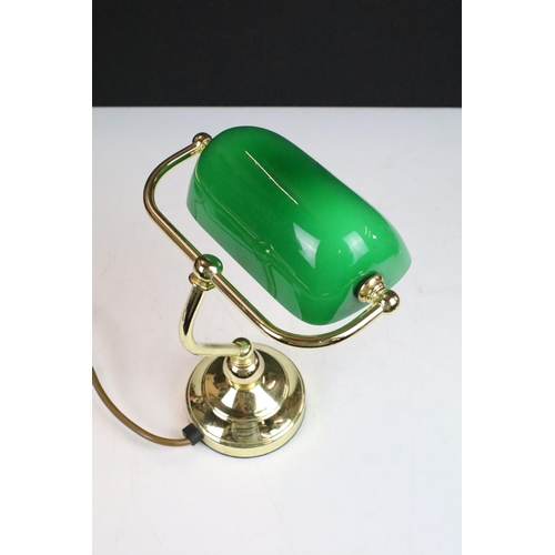 96 - Banker’s style desk lamp of small proportions with green glass adjustable shade and gilt base, 23cm ... 