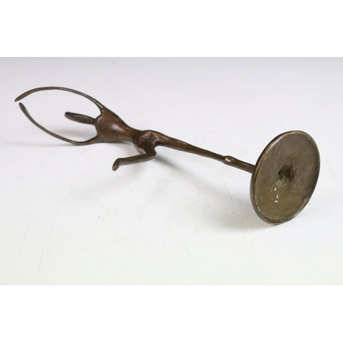 98 - Bronze model of a stylised ballerina, 25cm high